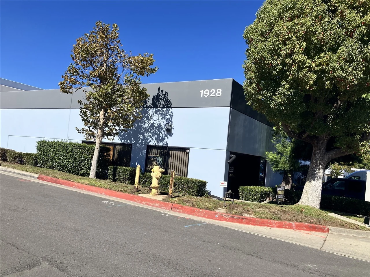 The front elevation of a commercial industrial building, photographed during scoping
