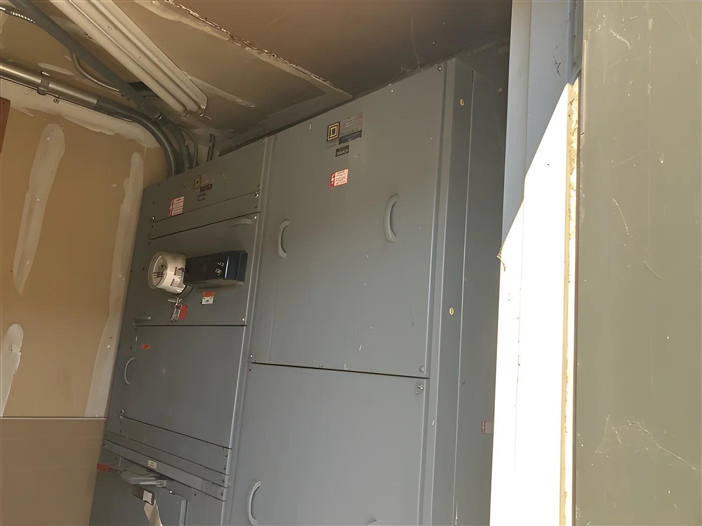 The main panel and switchgear in the electrical room of a commercial building