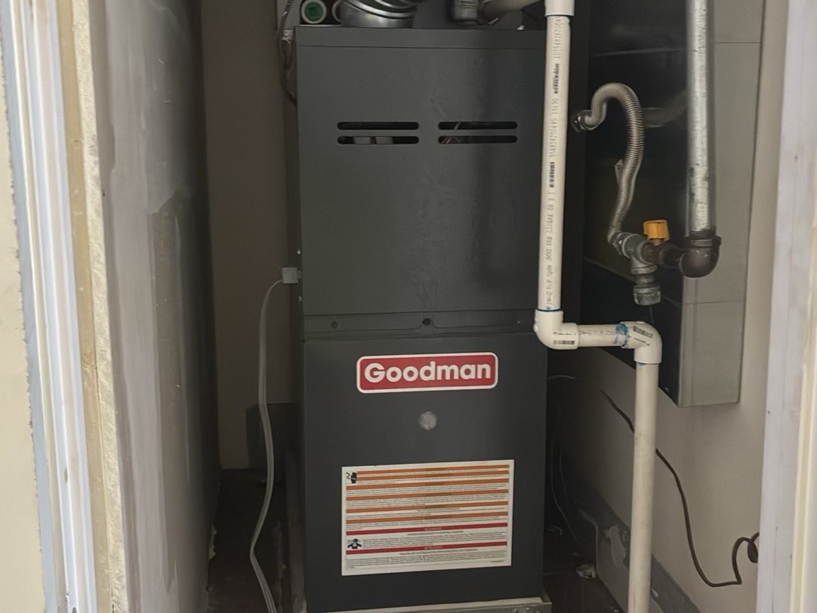 Goodman high-efficiency gas furnace in a utility closet