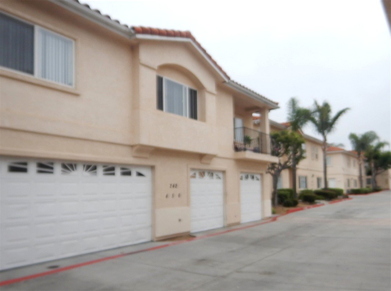 Apartment building at 242 Kennedy St Tuscany Townhomes Chula Vista during a balcony and walkway inspection