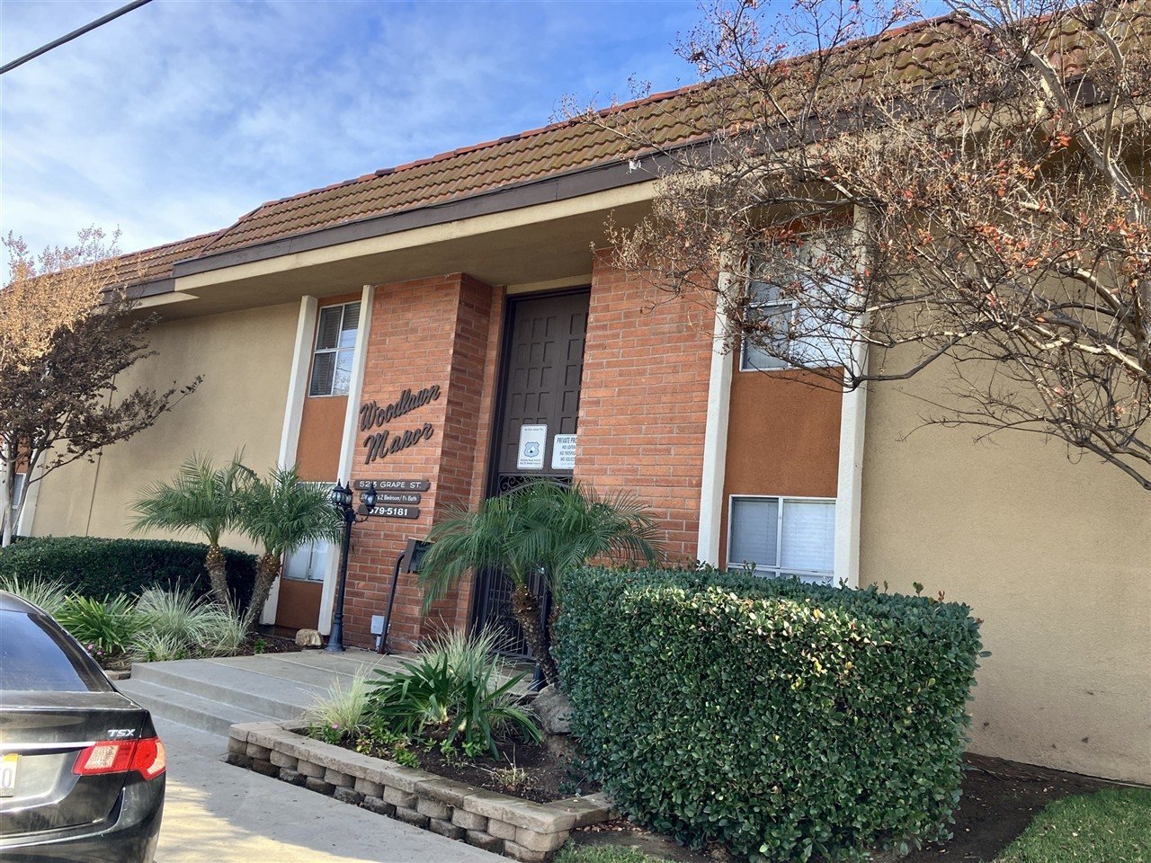 Apartment building at 523 Grape St Woodlawn Manor during a balcony and walkway inspection