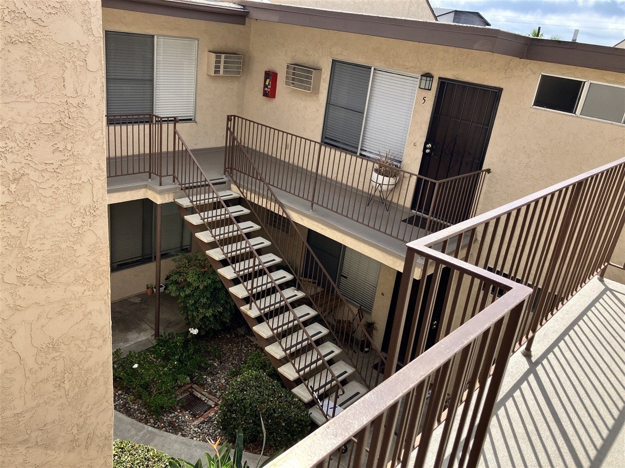 Apartment building at 5614 Lauretta St Lauretta 7 during a balcony and walkway inspection