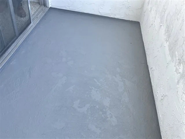 Fiberglass waterproof traffic coating on a condo balcony deck during a San Diego SB-326 inspection.